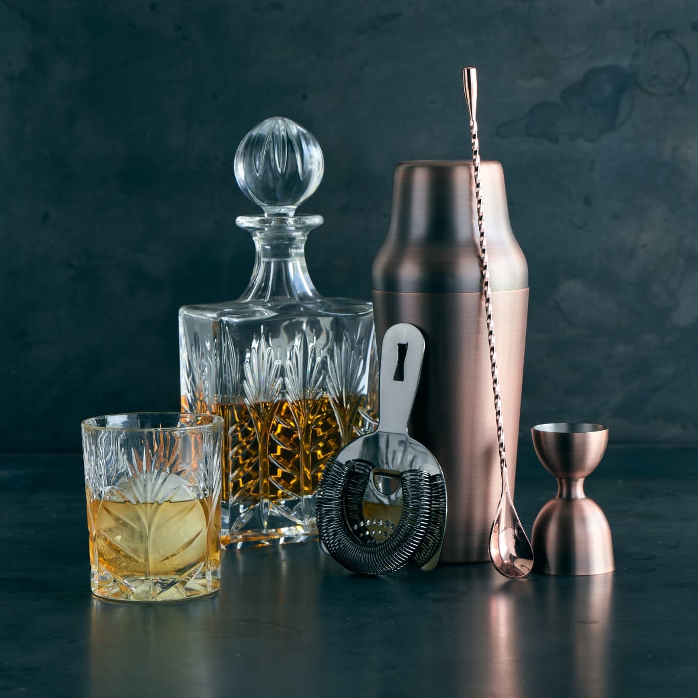 Cocktail shaker set and a bottle of alcohol